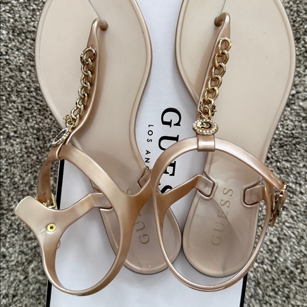 Women’s Guess gladiator sandals soft pink champagne color worn once. Size 7